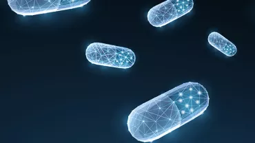 Des capsules bleues en lumière numérique flottent sur fond sombre.