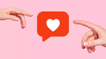 Deux mains s'approchent d'une bulle de dialogue avec un cœur.