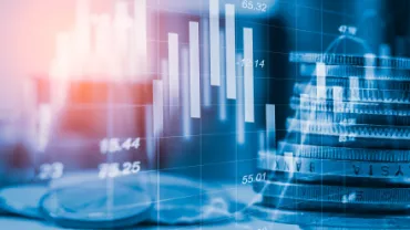 Graphique de données financières avec pièces empilées.