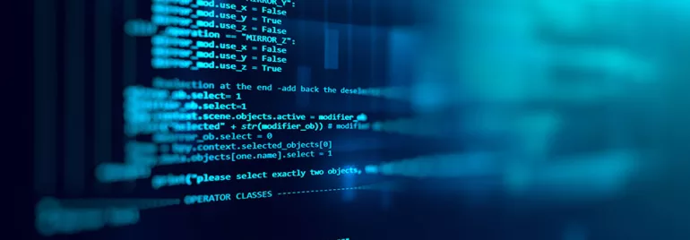 Écran d'ordinateur affichant du code source en bleu.