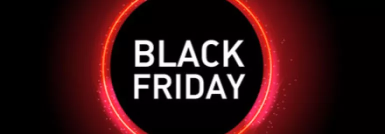 Texte Black Friday sur fond noir avec cercle lumineux.