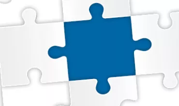 Pièce de puzzle bleue au centre d'un puzzle blanc.