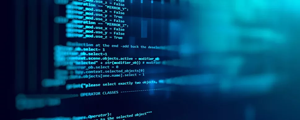 Écran d'ordinateur affichant du code source en bleu.